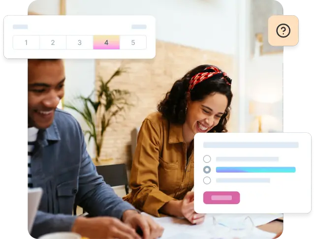 Two people smiling and working together on market research.